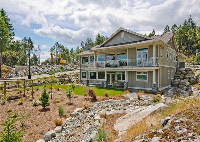 Nanoose Custom Home: Built Green Gold: Back exterior landscaped