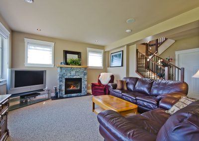 Nanoose Custom Home: Built Green Gold: Walk out basement tv room
