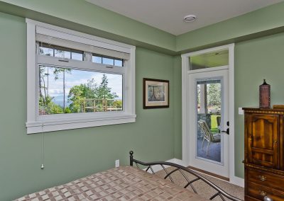 Nanoose Custom Home: Built Green Gold: Guest Bedroom with deck access