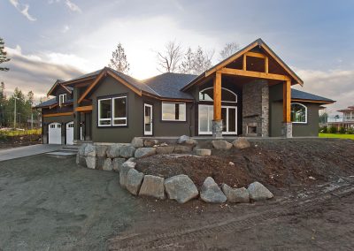 Saltair Custom Home with Detached Carriage house: Stucco Rock and Cedar siding