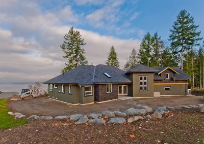 Saltair Custom Home with Detached Carriage house: Exterior rear view
