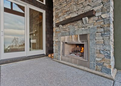 Saltair Custom Home with Detached Carriage house: Stone fireplace