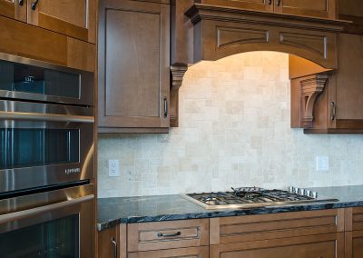 Saltair Custom Home with Detached Carriage house: Travertine backsplash