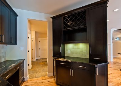 Saltair Custom Home: Charcoal maple cabinets